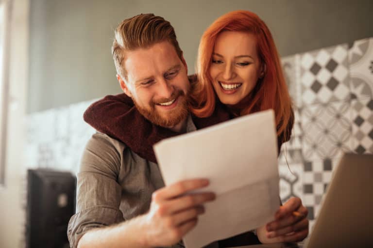 Couple enjoying their income tax refunds